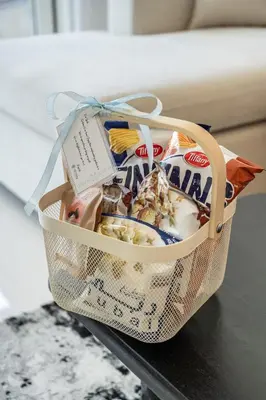 a basket filled with food on a table at Airstay - Minimalist 1BR - EMAAR Beachfront - Monthly Offer Available in Dubai