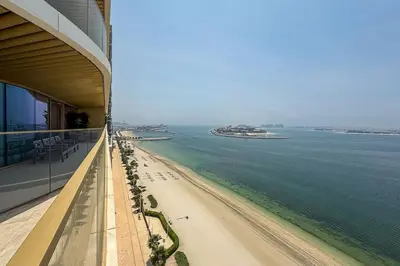 a view of the beach from the balcony of a building at Airstay - Minimalist 1BR - EMAAR Beachfront - Monthly Offer Available in Dubai