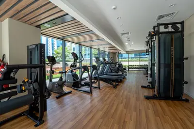 a gym with treadmills and cardio equipment in a building at Facing the Dubai Water Canal 1BR, Minutes from Metro with Easy Downtown Access, Zada Tower, Business Bay by Deluxe Holiday Homes in Dubai