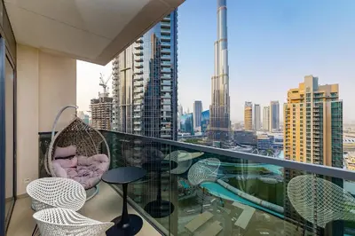 a balcony with a view of a city at Burj View Stylish 3BR with Maids Room in Act One Tower Downtown in Dubai