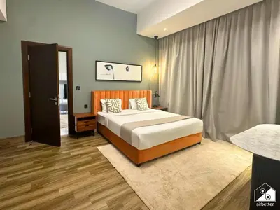 a bedroom with a large bed and a window at Chic 1BR in Business Bay l Pool, Gym & Sauna in Dubai