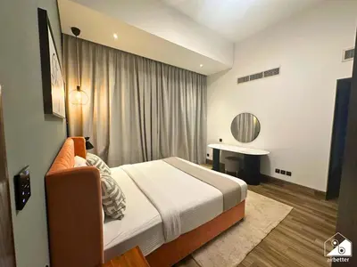 a hotel room with a bed and a desk at Chic 1BR in Business Bay l Pool, Gym & Sauna in Dubai