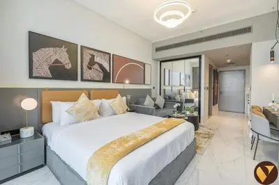 a bedroom with a large bed and a living room at Vogue Downtown Mag 318 near Burj Khalifa and Dubai Mall, Studio Apartment with Balcony, Canal and City View, Access to all Amenities in Dubai