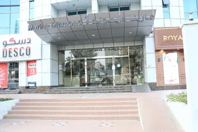 a building with a staircase in front of a store at Modern Studio in Marina in Dubai