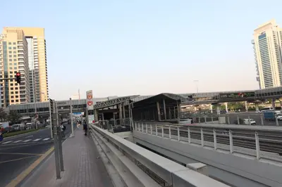 a train station on a bridge in a city at Modern Studio in Marina in Dubai