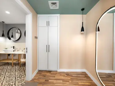 a bathroom with white cabinets and a mirror at 4 BHK Duplex - Marina & JBR - Iconic Dubai Skyline in Dubai