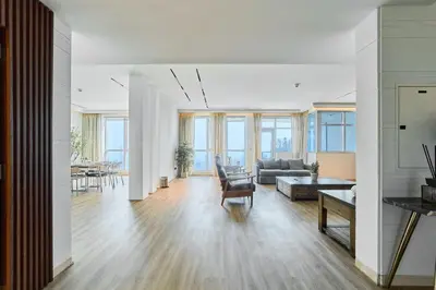 a living room with a couch and a table at Exclusive Torch Tower Penthouse In Dubai Marina in Dubai