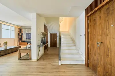 a hallway with a staircase in a house at Exclusive Torch Tower Penthouse In Dubai Marina in Dubai