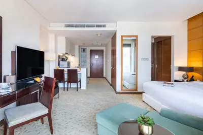 a hotel room with a bed and a desk at Luxury Studio Burj Khalifa View Address Dubai Mall in Dubai