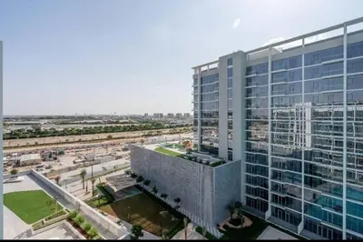 an aerial view of a large office building with a roadway at 1 Bedroom lagoon by District One in Dubai