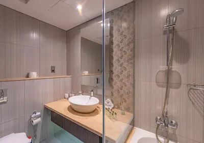 a bathroom with a sink and a shower at Chic 2BR in Damac Hills with Golf & Pool View in Dubai