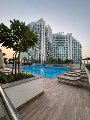 a view of a large building with a swimming pool at Luxury Studio Burj Khalifa View in Dubai
