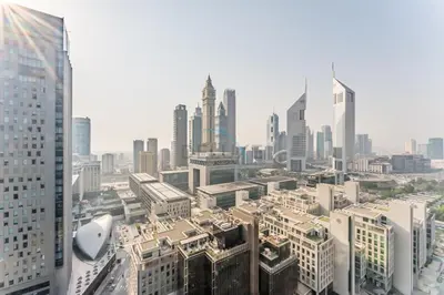 an aerial view of a city with tall buildings at Iconic Views of the Future Museum, Minutes from Metro & Key Attractions, Sky Gardens, DIFC by Deluxe Holiday Homes in Dubai