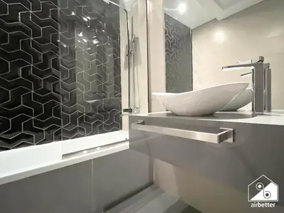 a bathroom with a sink and a shower at Gorgeous Studio with balcony l Business Bay in Dubai