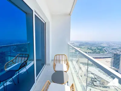 a balcony with chairs and a view of the city at Gorgeous Studio with balcony l Business Bay in Dubai