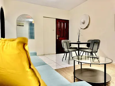 a living room with a couch and a table at 5 mins walk to Burjuman metro in Dubai