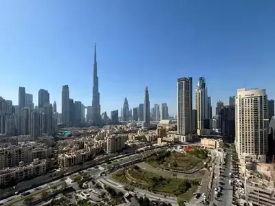 an aerial view of a city with tall buildings at Vogue Business Bay Damac Maison Prive near Burj Khalifa and Dubai Mall, One Bedroom Apartment with Balcony, Canal and City Skyline View, Access to all Amenities in Dubai