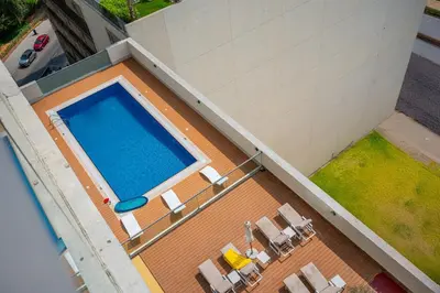 an overhead view of a swimming pool on a building at Contemporary 1BHK with Home Feel in Dubai