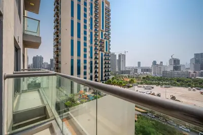a balcony of a building with a view of a city at Contemporary 1BHK with Home Feel in Dubai