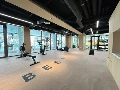 a gym with treadmills and exercise equipment in a building at Modern 1BR with Private Jacuzzi in Business Bay in Dubai