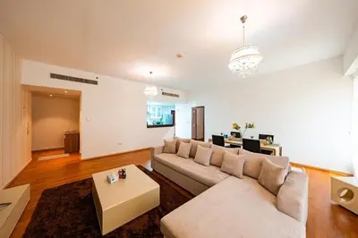 a living room with a couch and a table at Rimal 4 in Dubai