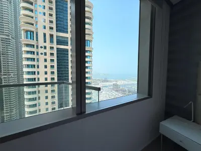a room with a window with a view of a city at Ocean Heights New 2BDR with full Sea & Dubai Eye view in Marina by Simplex Home in Dubai