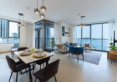 a living room with a table and chairs at Stunning 2 Bedroom at Dubai Creek in Dubai