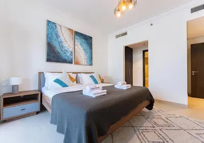 a bedroom with a large bed in a room at Stunning 2 Bedroom at Dubai Creek in Dubai
