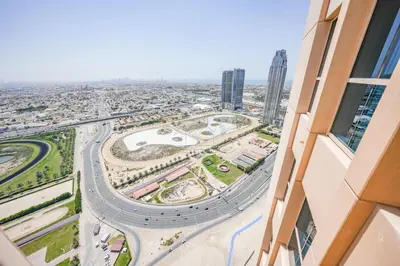 a view of a city from a building at Luxury 2BR with Burj and Ocean Views in Dubai