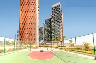 a basketball court in a city with tall buildings at Luxury 2BR with Burj and Ocean Views in Dubai