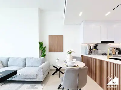 a living room with a couch and a table at Luxury & Comfort 1B at Binghatti Amber & Balcony in Dubai