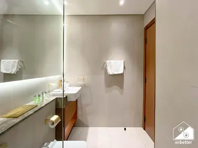 a bathroom with a shower and a toilet and a sink at Luxury & Comfort 1B at Binghatti Amber & Balcony in Dubai