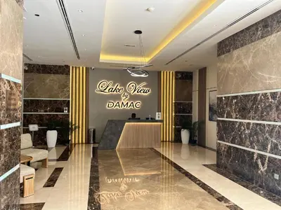 a lobby with a sign that reads take view of dance at HiGuests - Huge Duplex for Creative Inspiration! in Dubai