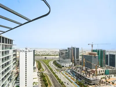 an aerial view of a city with tall buildings at Luxury Smart 1BR -High Floor Business Bay Views in Dubai