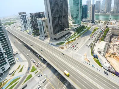 an overhead view of a highway in a city with traffic at Luxury Smart 1BR -High Floor Business Bay Views in Dubai