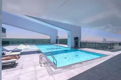 a large swimming pool on top of a building at Vogue Al Wasl 1 Residences Near Zabeel Park and World Trade Centre, One Bedroom Apartment with Balcony and City View, Access to all Amenities, Walkable to Max Fashion Metro Station in Dubai