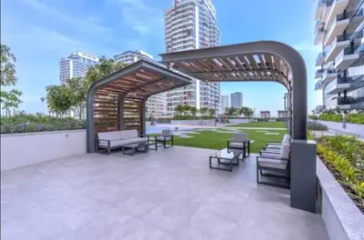 a pavilion with benches and chairs on a patio at Vogue Al Wasl 1 Residences Near Zabeel Park and World Trade Centre, One Bedroom Apartment with Balcony and City View, Access to all Amenities, Walkable to Max Fashion Metro Station in Dubai