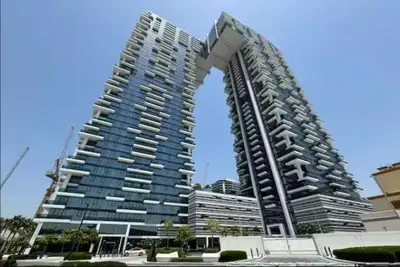 a large building with an arch in front of it at Vogue Al Wasl 1 Residences Near Zabeel Park and World Trade Centre, One Bedroom Apartment with Balcony and City View, Access to all Amenities, Walkable to Max Fashion Metro Station in Dubai