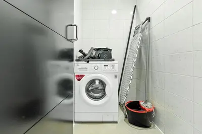 a washing machine with a camera on top of it at 1BR at Ocean Heights Next to Tram Station in Dubai