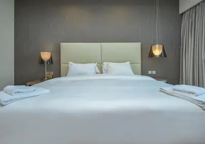 a large white bed in a hotel room at PARAMOUNT TOWER B BUSINESS Bay Lux 1 bedroom Apt in Dubai