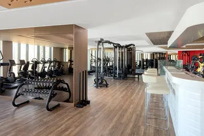 a gym with several treadmills and tread machines at PARAMOUNT TOWER B BUSINESS Bay Lux 1 bedroom Apt in Dubai