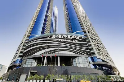 a large building with a sign on the side of it at PARAMOUNT TOWER B BUSINESS Bay Lux 1 bedroom Apt in Dubai
