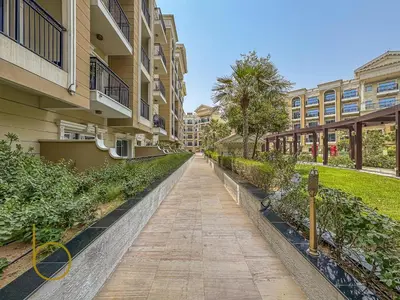 a walkway in front of a building at Bookable- Studio Resortz By Danube with Balcony in Dubai