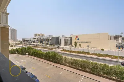 an empty parking lot with a street in a city at Bookable- Studio Resortz By Danube with Balcony in Dubai