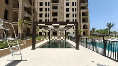 a swimming pool in the middle of a building at StayShort - MJL Apartment for 2 people near Water Parks in Dubai