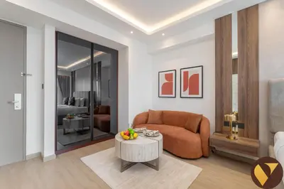 a living room with a couch and a table at Vogue Marina JW Marriott with Direct Access to Marina Mall, Studio Apartment with Balcony and Marina Skyline View, Access to all Amenities in Dubai