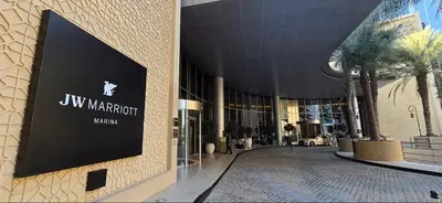 a building with a sign on the side of it at Vogue Marina JW Marriott with Direct Access to Marina Mall, Studio Apartment with Balcony and Marina Skyline View, Access to all Amenities in Dubai