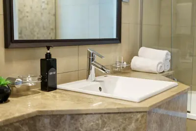 a bathroom sink with a faucet on a counter at Gorgeous 2BR in DIFC close to Metro & Dubai Mall in Dubai
