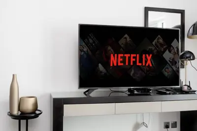 a flat screen tv sitting on top of a table at Downtown Dubai Studio Apartment - High floor in Dubai