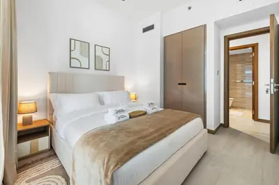 a bedroom with a large white bed in a room at BLVD - Stylish Missoni Stay - Canal View in Dubai